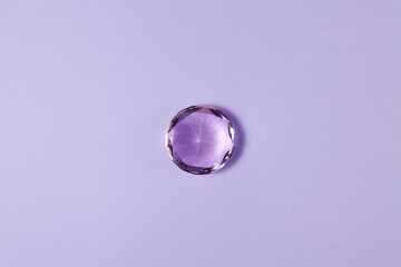 Purple precious gemstones for design gems jewellery. Diamonds crystal on turquoise background.