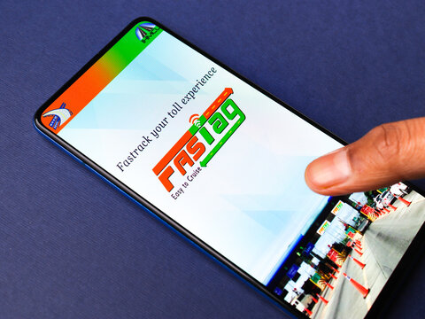 Assam, india - March 10, 2021 : FASTag logo on phone screen stock image.