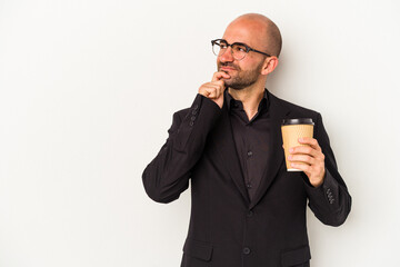 Young business bald man holding take away coffee isolated on white background  looking sideways with doubtful and skeptical expression.