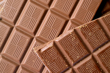 Closeup heap of cracked chocolate bar with selective focus
