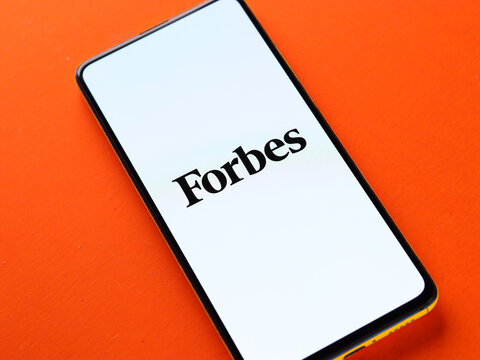 Assam, india - November 15, 2020 : Forbes logo on phone screen stock image.