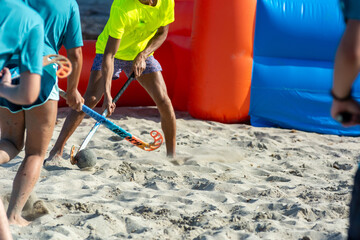 Guys Playing Beach Hokey on Official Competition in Summer on the Sand