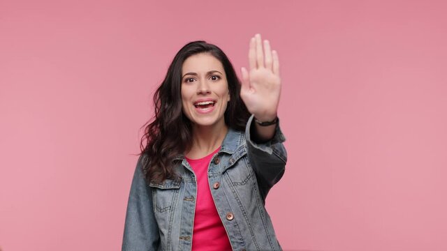 Girl showing stop gesture with palm crossed hands say no. Displeased disgusted woman 20s years old in casual jacket pink t-shirt posing isolated on pink background studio. Lifestyle concept.