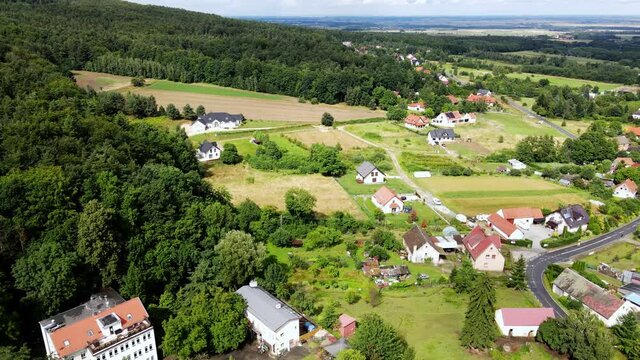 Mountain village with forests, bird eye view. Sleza mountain landscape near Wroclaw in Poland. Nature background, aerial view.