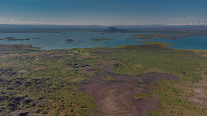 Aerial drone panorama of lake Myvatn in iceland on a summer day as seen from high above from the famous crater nearby.