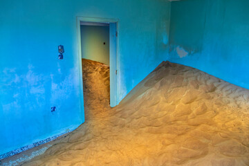 blue room with a lot of sand in old house in lost village in UAE