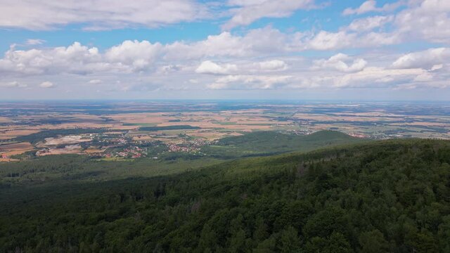 Drone flight over mountain village with forests. Sleza mountain near Wroclaw in Poland. Nature background, aerial view