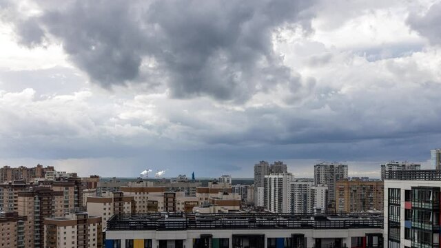 thunderstorm over the city, storm clouds in a storm over the residential buildings of the city