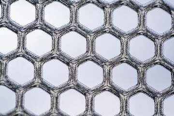 Hexagonal abstract background backdrop. Printed on a 3D printer with transparent plastic.