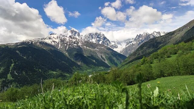 Time-lapse. Mt. Ushba double peak in the summertime