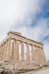 Obraz premium Bottom view of The Parthenon. Acropolis hill in Athens, Greece. Ancient architecture of Europe. Antique temple. Huge columns. Nobody.