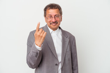 Middle aged indian business man isolated on white background pointing with finger at you as if inviting come closer.