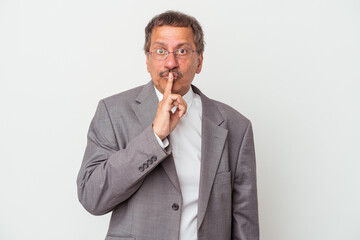 Middle aged indian business man isolated on white background keeping a secret or asking for silence.