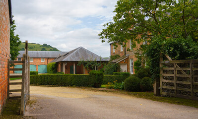 Georgian style architecture of Manor Farm in the small village of Huish on the South facing edge of the Marlborough Downs, adjacent to Pewsey Vale, Wiltshire UK