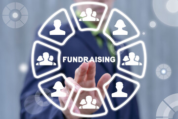 Concept of fundraising. Fundraiser using virtual touchscreen clicks a fundraising word.