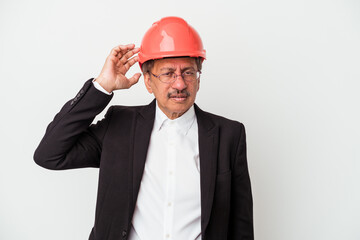 Middle aged indian architect man isolated on white background being shocked, she has remembered important meeting.