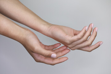 beautiful hands with manicured nude nails manicure. 