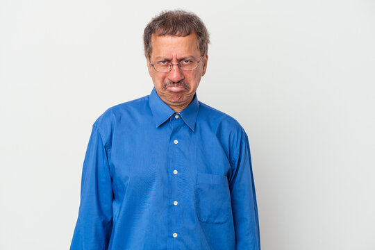Middle aged indian man isolated on white background sad, serious face, feeling miserable and displeased.