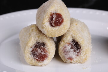 Traditional Brazilian sweet called Goiabinha. These buttery cookie have guava jelly inside. 