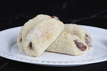 Traditional Brazilian sweet called Goiabinha. These buttery cookie have guava jelly inside. 
