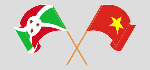 Crossed and waving flags of Burundi and Vietnam
