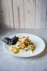 seafood salad and basil leaves. Empty space for text.