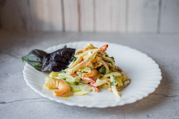 seafood salad and basil leaves.