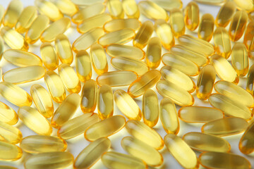 Omega 3 capsules close up. Fish fat. Background 