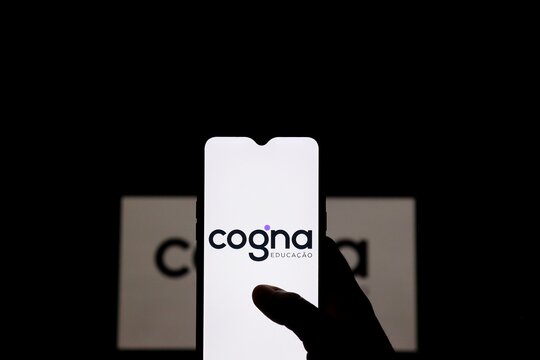 Bahia, Brazil - August 13, 2021: Cogna logo on smartphone screen. Cogna is a Brazilian company in the higher education segment.