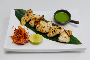 indian food speciality tandoori malai chicken tikka, cream based marinated chicken cubes cooked in clay oven