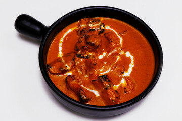 butter chicken curry or masala, indian food delicacy, chicken cooked in rich tomato cashewnut gravy