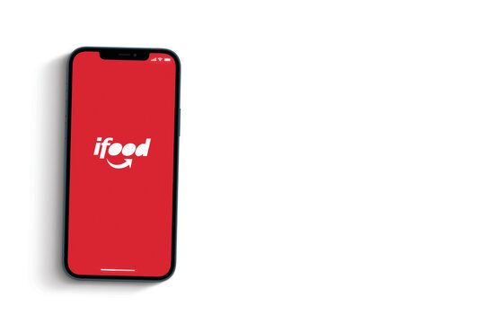 Ifood app on smartphone screen on white background. Ifood logo, digital online food ordering application. Top view. Rio de Janeiro, RJ, Brazil. June, 2021.