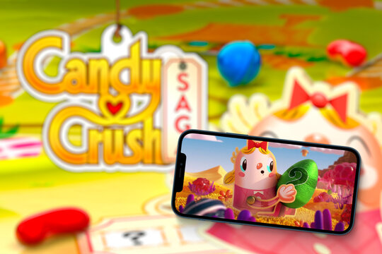 Candy Crush Saga game app on smartphone screen with the game blurred in the background.. Rio de Janeiro, RJ, Brazil. August 2021