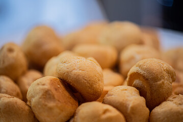 Fresh baked golden bread rolls in bread basket