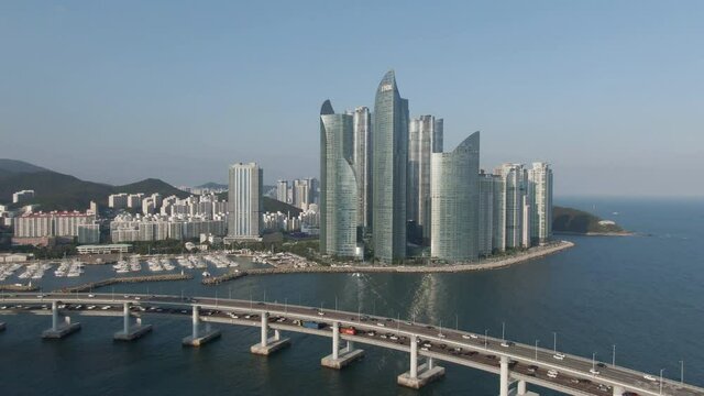Suyeong Bay of skyscraper in the Busan. The moored boats are visible. May, 2021. 부산 수영만 초고층 빌딩, 수변공원.