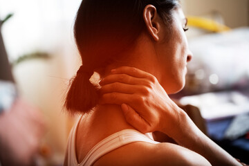 Young woman is having neck pain. Neck pain. Background. Pain. 
