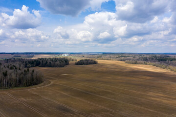 Aerial view of agricultural landscape with fields in spring season.