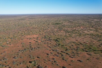 Outback Australia aerial drone photo over the wild rural dry red center desert landscape of Western...