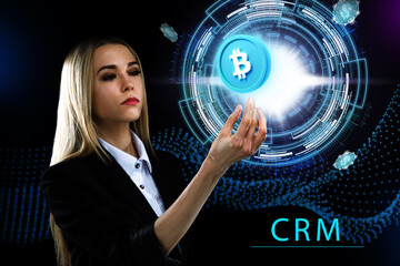 Business, Technology, Internet and network concept. Young businessman working on a virtual screen of the future and sees the inscription: CRM