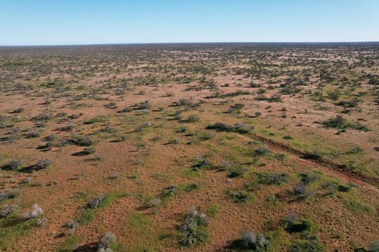 Outback Australia aerial drone photo over the wild rural dry red center desert landscape of Western Australia