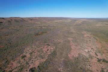 Outback Australia aerial drone photo over the wild rugged limestone mountain ranges and dry desert landscape of Cape Range National Park, Ningaloo Coast