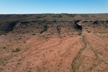 Outback Australia aerial drone photo over the wild rugged limestone mountain ranges and dry desert...