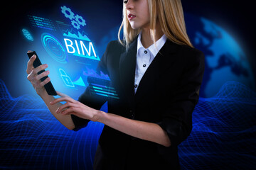 Business, Technology, Internet and network concept. Young businessman working on a virtual screen of the future and sees the inscription: BIM