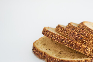 Sliced whole wheat bread on white background for cutting out.