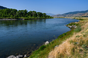 Fototapeta na wymiar Peaceful day on the Gallatin River in Montana, nature landscape as a background 