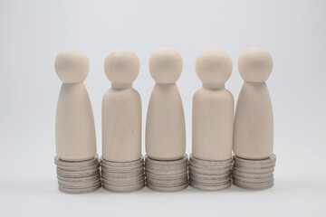 the wood Figure On Increasing Stacked Coins