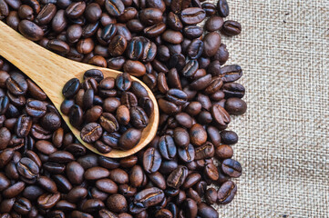 Coffee bean brown roasted isolated on a brown background