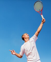 Portrait of a Male Tennis Player Serving