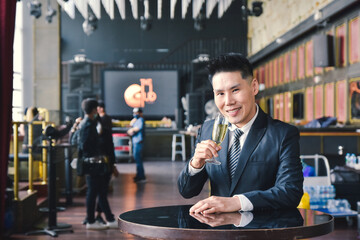 Businessman drink to celebrate at a corporate party.