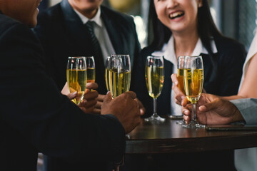 Closeup hand holding glasses wine for drink to celebrate teamwork business  success